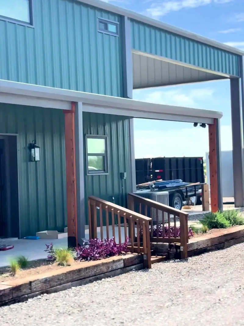 Barndominium-style metal building exterior with porch painted by Alvarez Painting